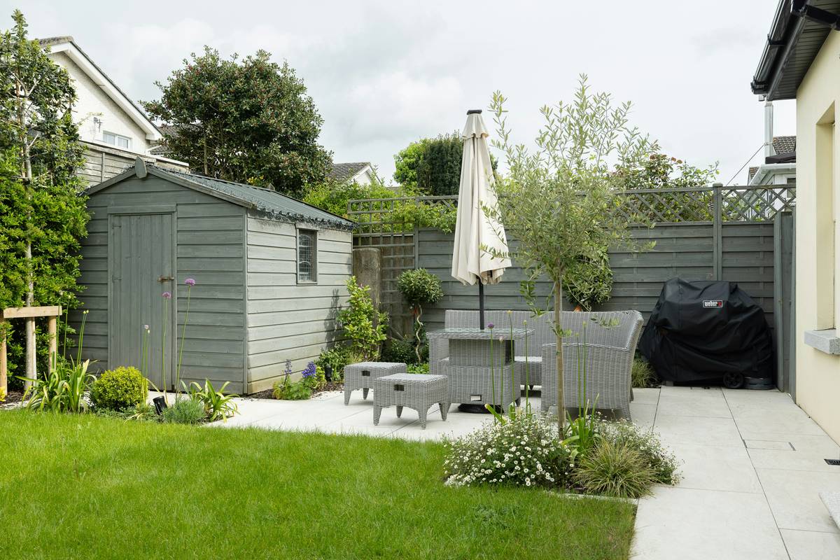 Family enjoying patio under durable shade umbrellas for backyard with weighted base and tilt feature