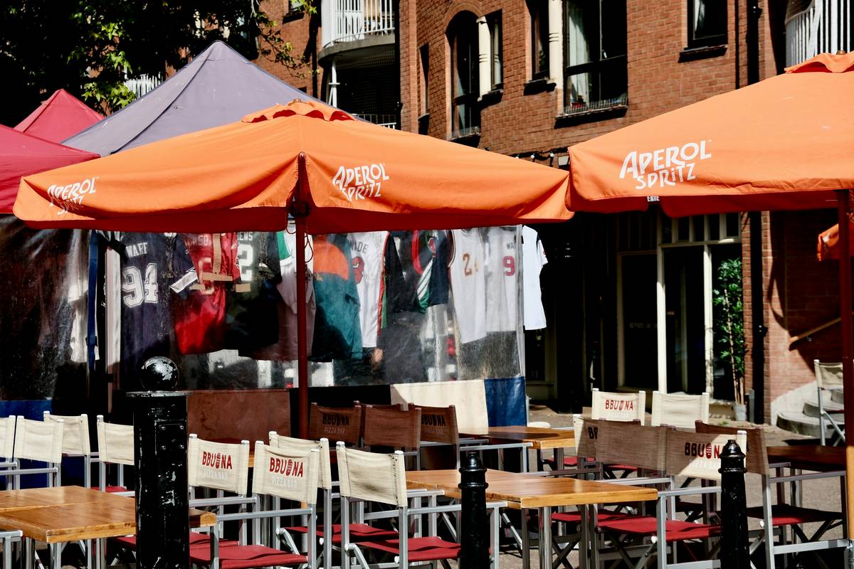 Family using durable beach umbrellas home depot model on sandy shore with wind-resistant canopy open